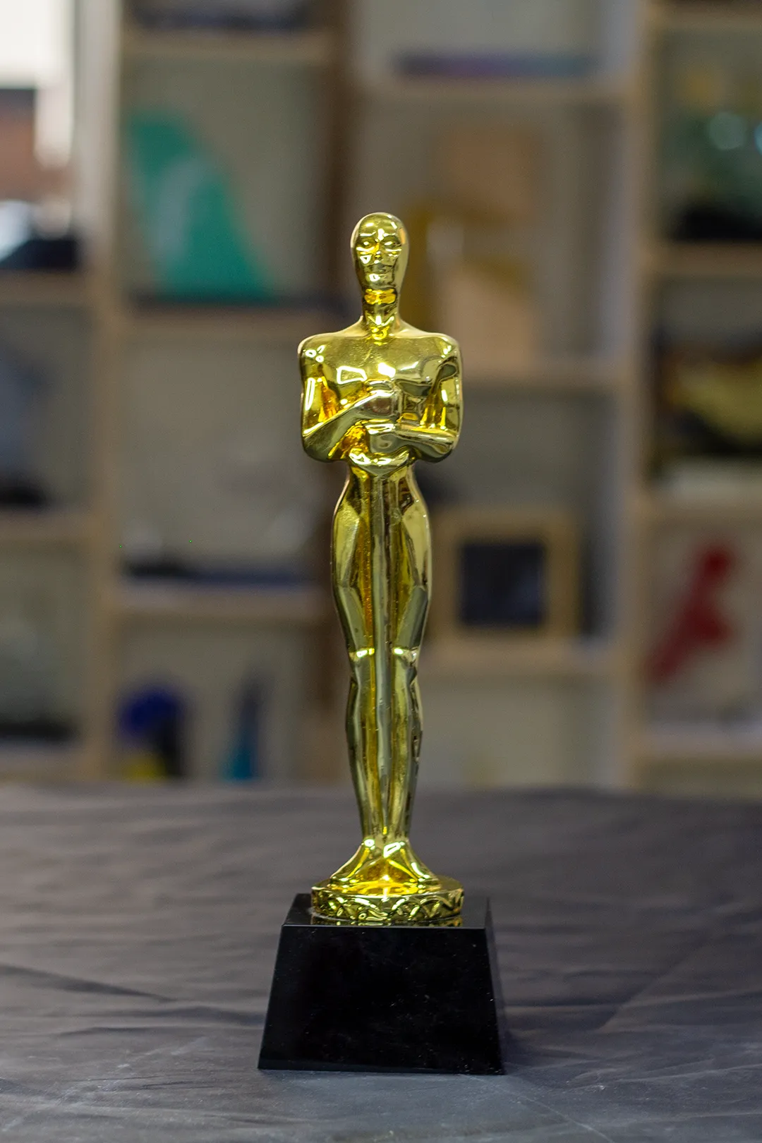 Gold Achievement Statuette on Black Pedestal Base